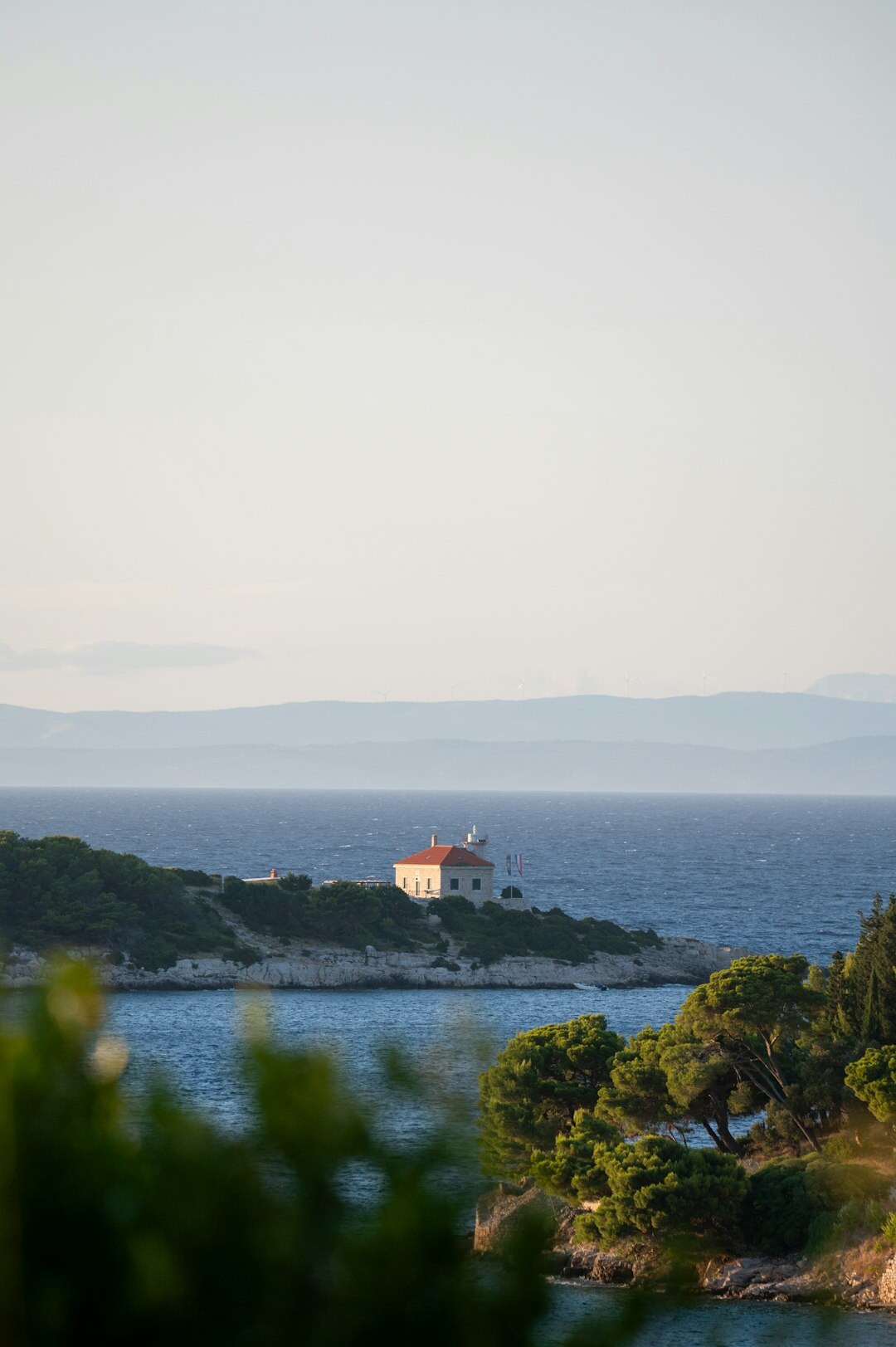 Lighthouse on a rocky Adriatic coastline at night