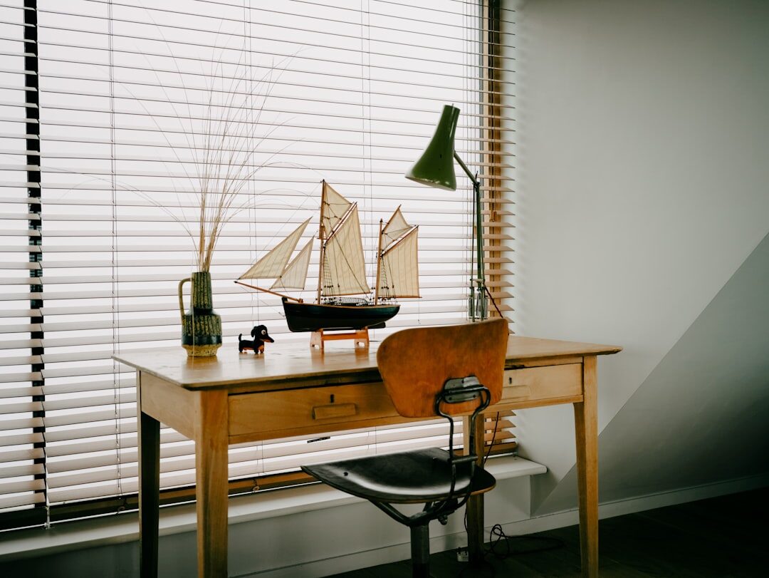 Vintage typewriter on a wooden desk with scattered papers