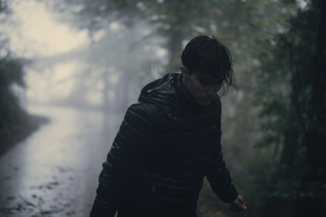 mysterious antihero in rain